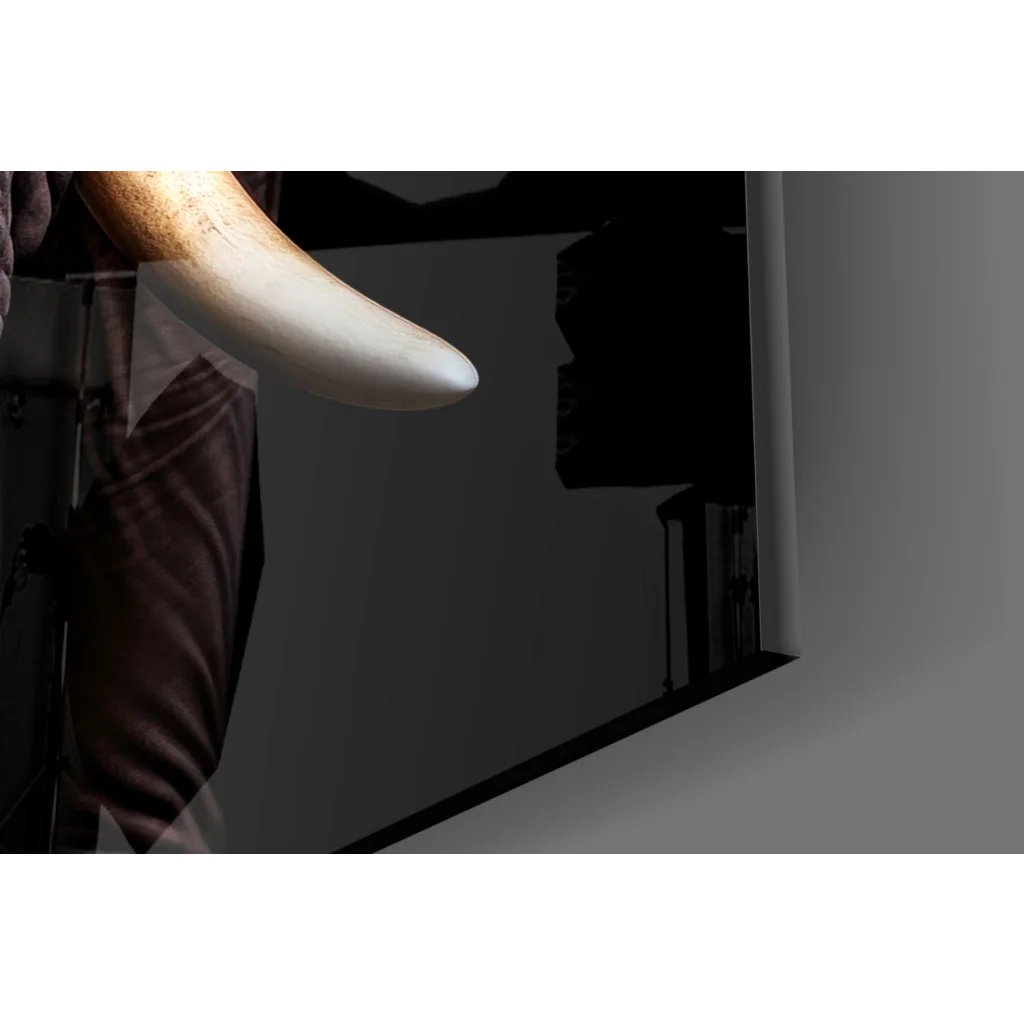 Polished ivory tusk glass wall art with textured elephant detail