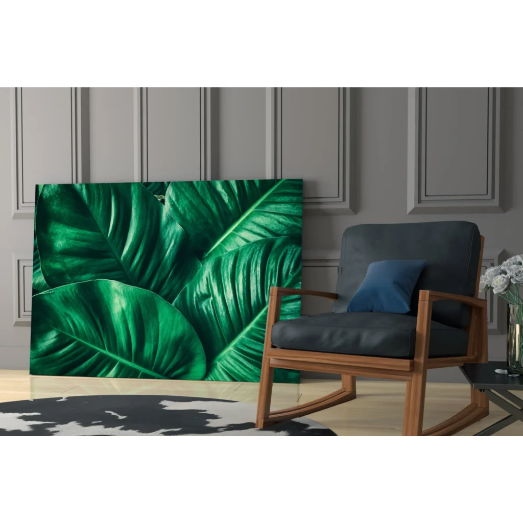 Vibrant emerald green glass wall art print of lush tropical leaves