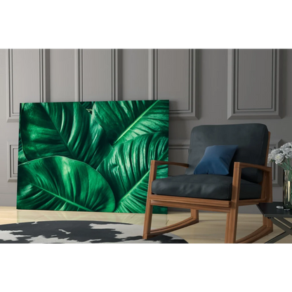 Vibrant emerald green glass wall art print of lush tropical leaves