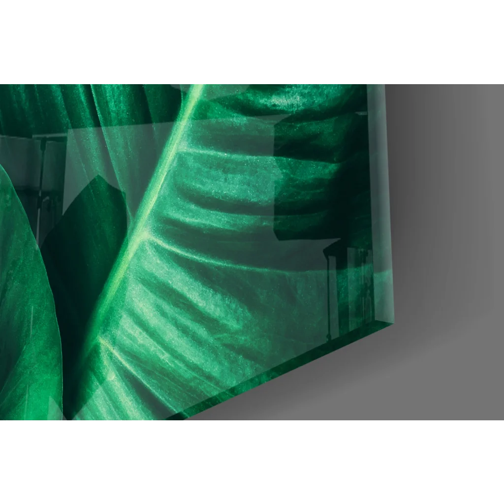 Vibrant emerald tropical leaf glass wall art with glossy translucent veins