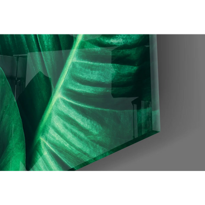Vibrant emerald tropical leaf glass wall art with glossy translucent veins