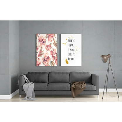 Gray sofa with floral throw and modern tripod lamp near stunning glass wall art