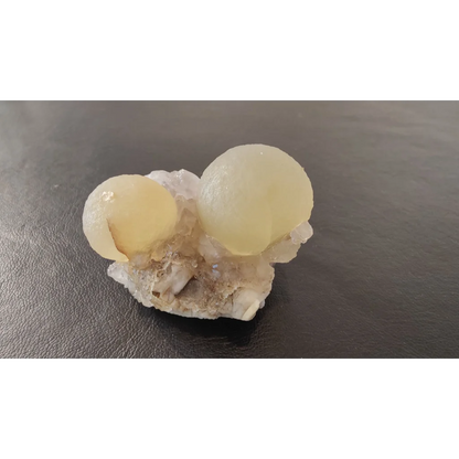 Stunning translucent pale yellow fluorite ball on quartz matrix from India