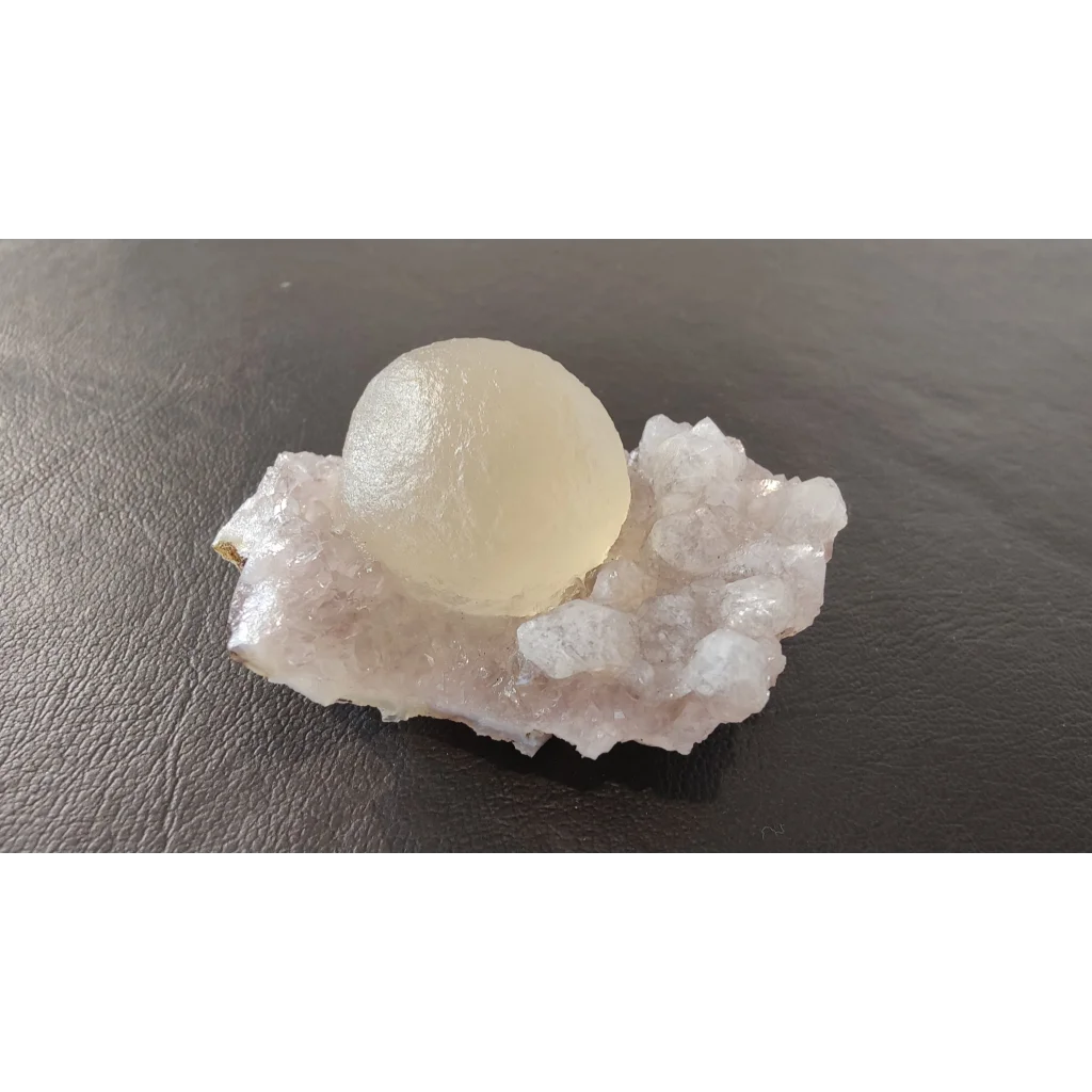 Stunning translucent pale yellow fluorite ball on quartz matrix from India
