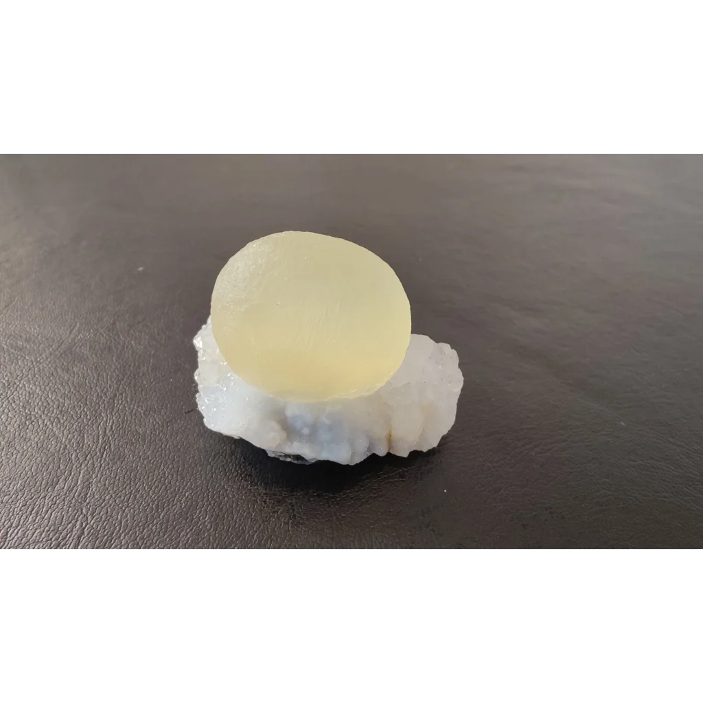 Stunning translucent pale yellow fluorite ball on quartz matrix from India