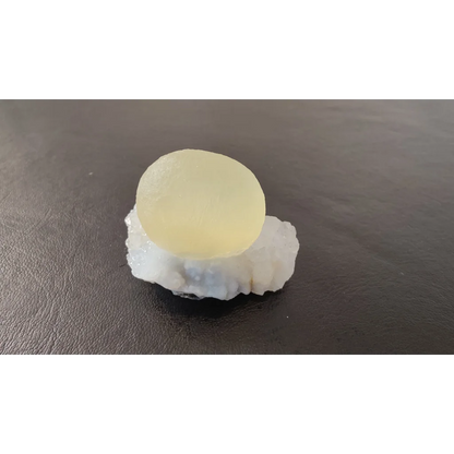 Stunning translucent pale yellow fluorite ball on quartz matrix from India