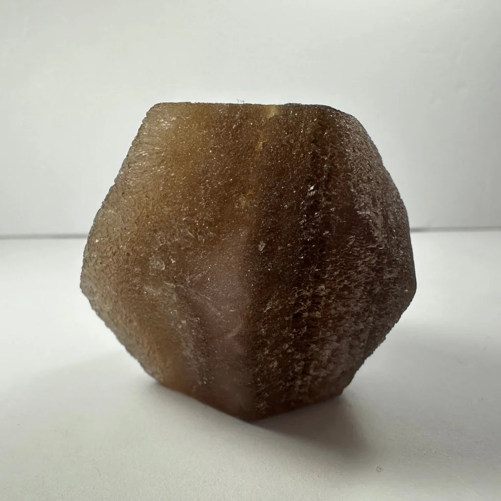 Stunning translucent brown fluorite dodecahedron crystal from China