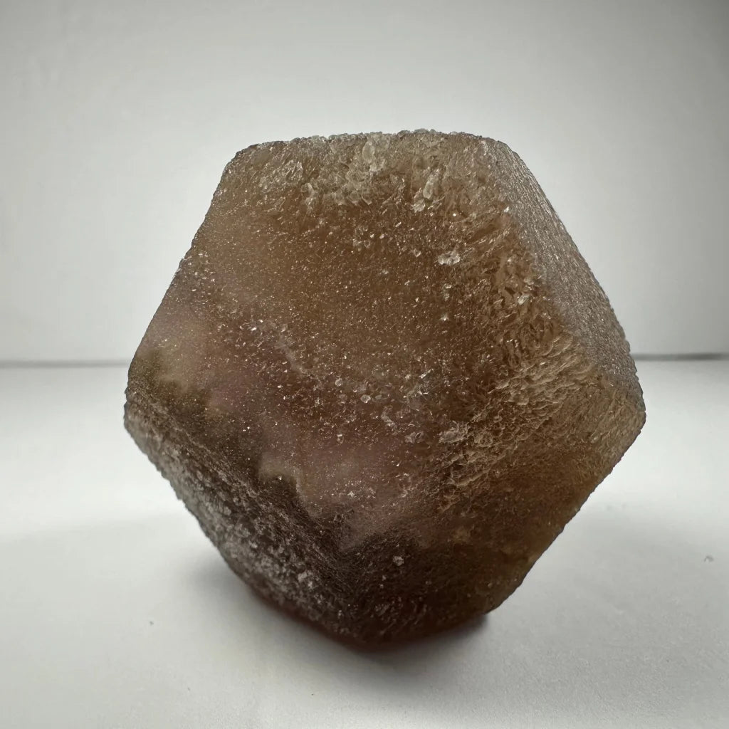 Stunning translucent brown fluorite dodecahedron crystal from China