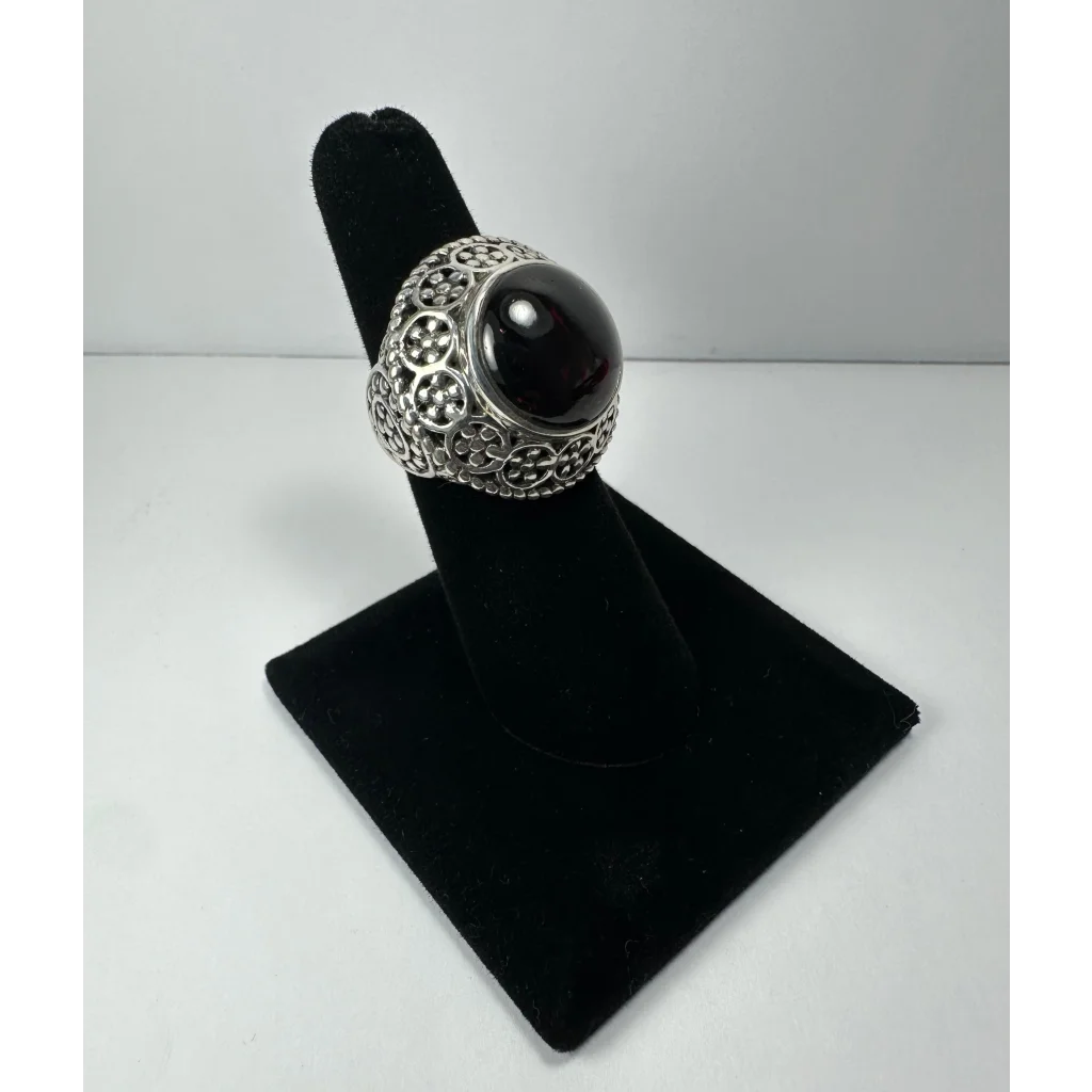 Stunning garnet ring with ornate silver filigree and black onyx stone