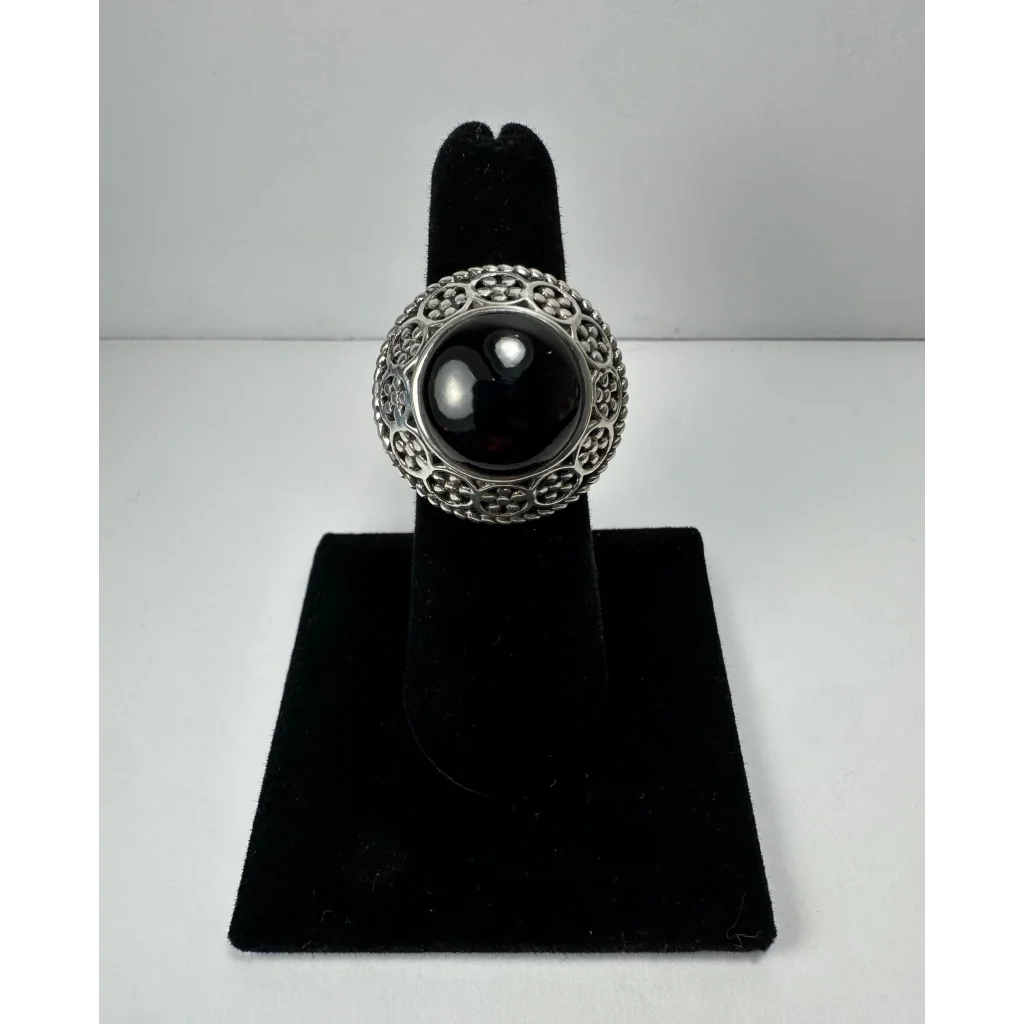 Stunning garnet ring with ornate silver filigree and black onyx stone