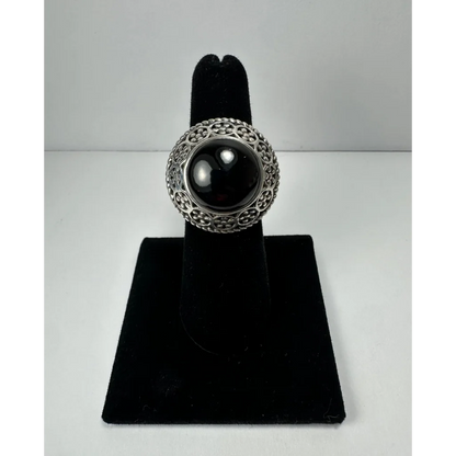 Stunning garnet ring with ornate silver filigree and black onyx stone