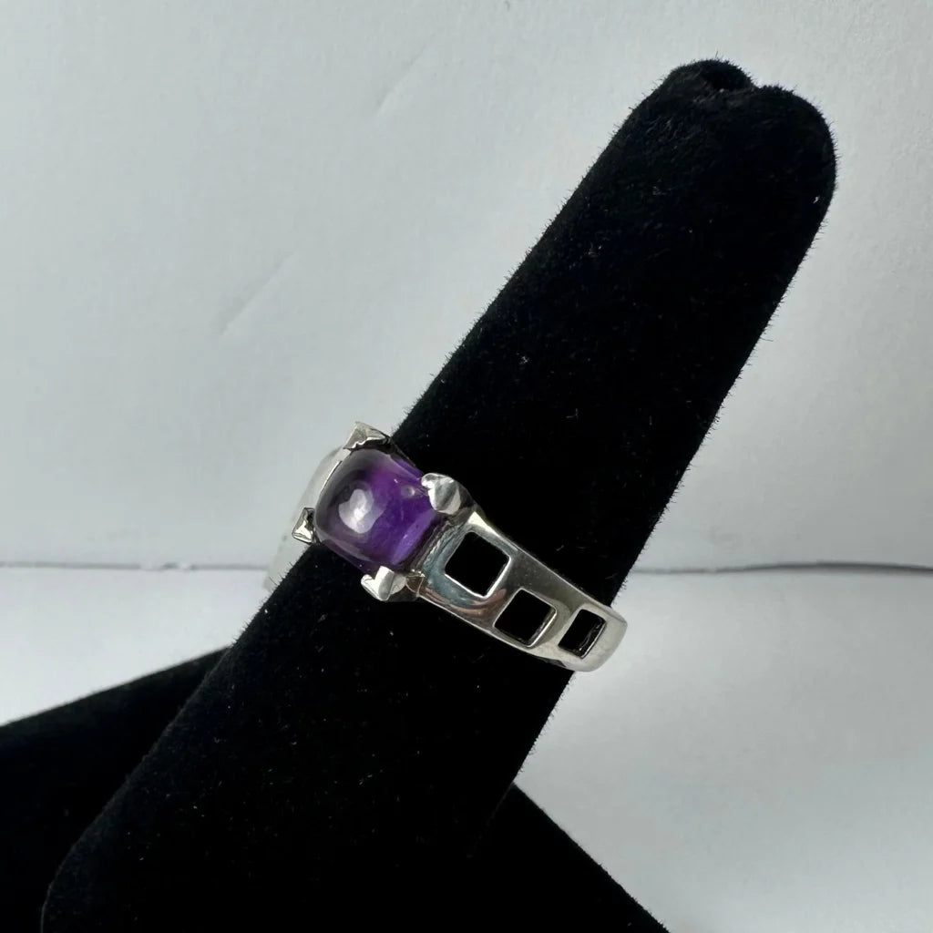 Stunning geometric amethyst ring in sterling silver with faceted purple stone