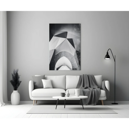 White modern sofa with geometric wall art throw blanket