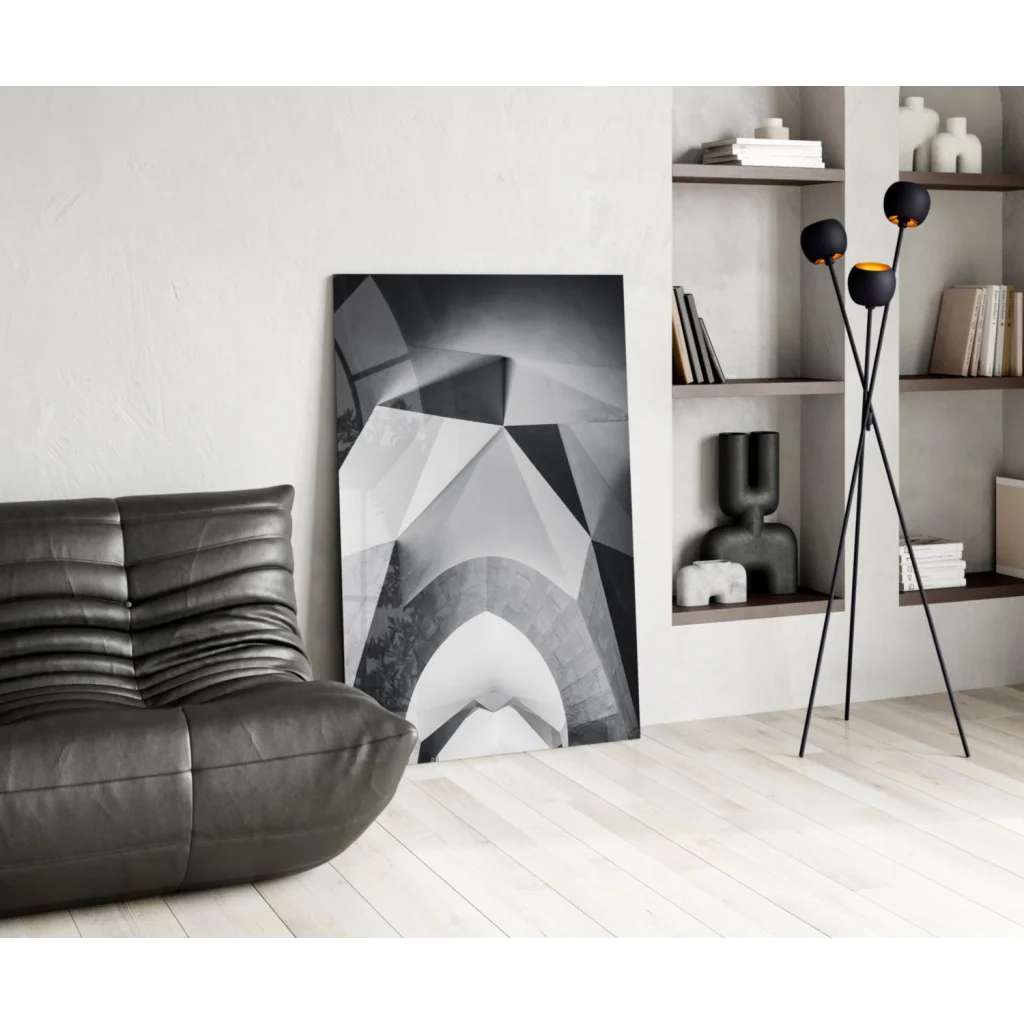 Black leather couch with stunning geometric wall art