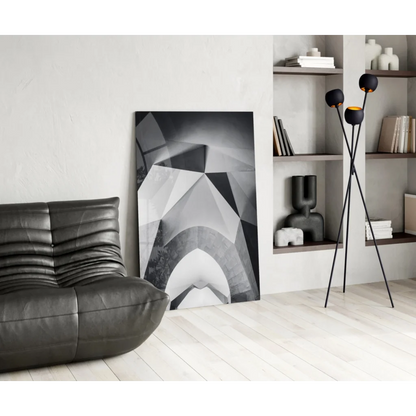 Black leather couch with stunning geometric wall art