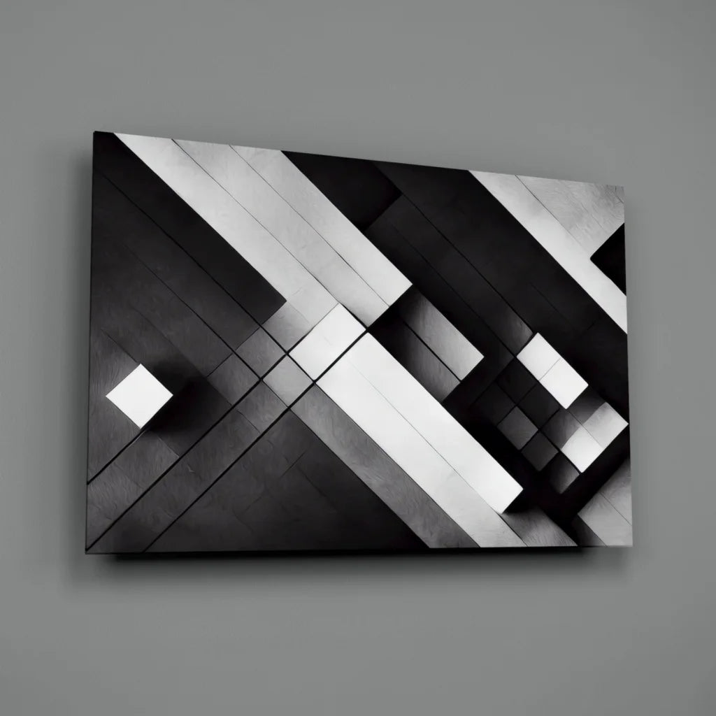 Black and white geometric glass wall art with glossy metallic shine