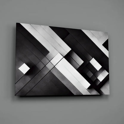 Black and white geometric glass wall art with glossy metallic shine