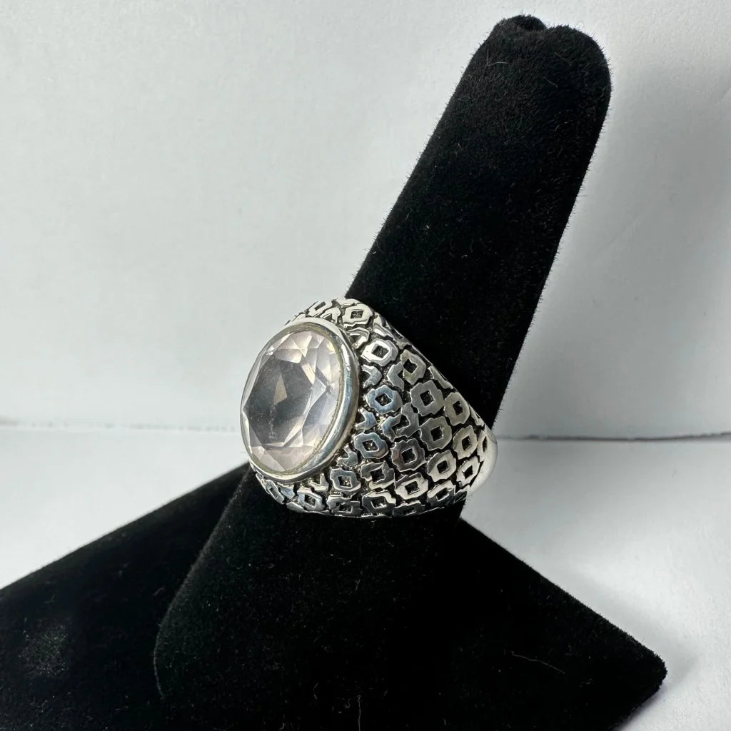 Stunning silver quartz ring with faceted clear stone and geometric band