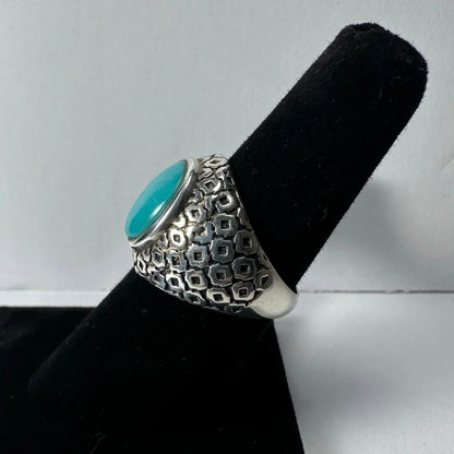 Bold silver turquoise ring with geometric pattern and vibrant center stone