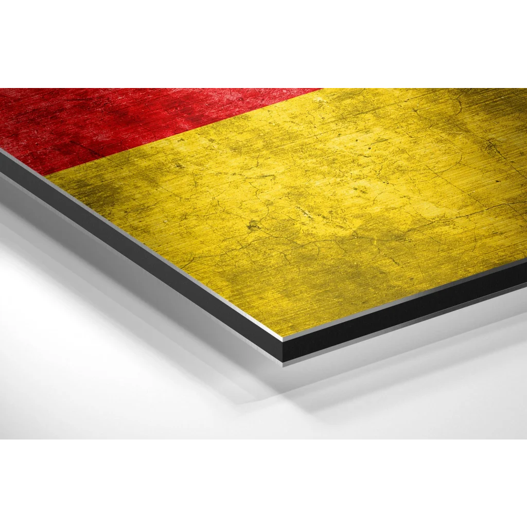 Glass Wall Art Red and yellow textured rug with black border on brushed aluminium dibond