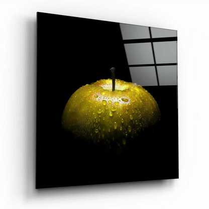 Glossy gold apple with water droplets in stunning glass wall art