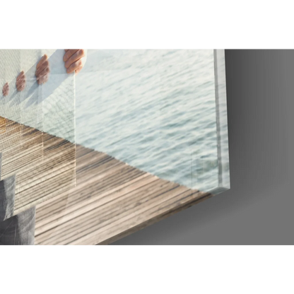 Stunning glass wall art of wooden ocean pier dock with water reflections