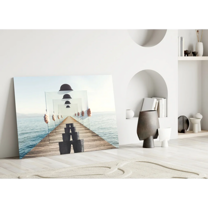 Modern glass wall art of mirrored figure on ocean pier in black and white