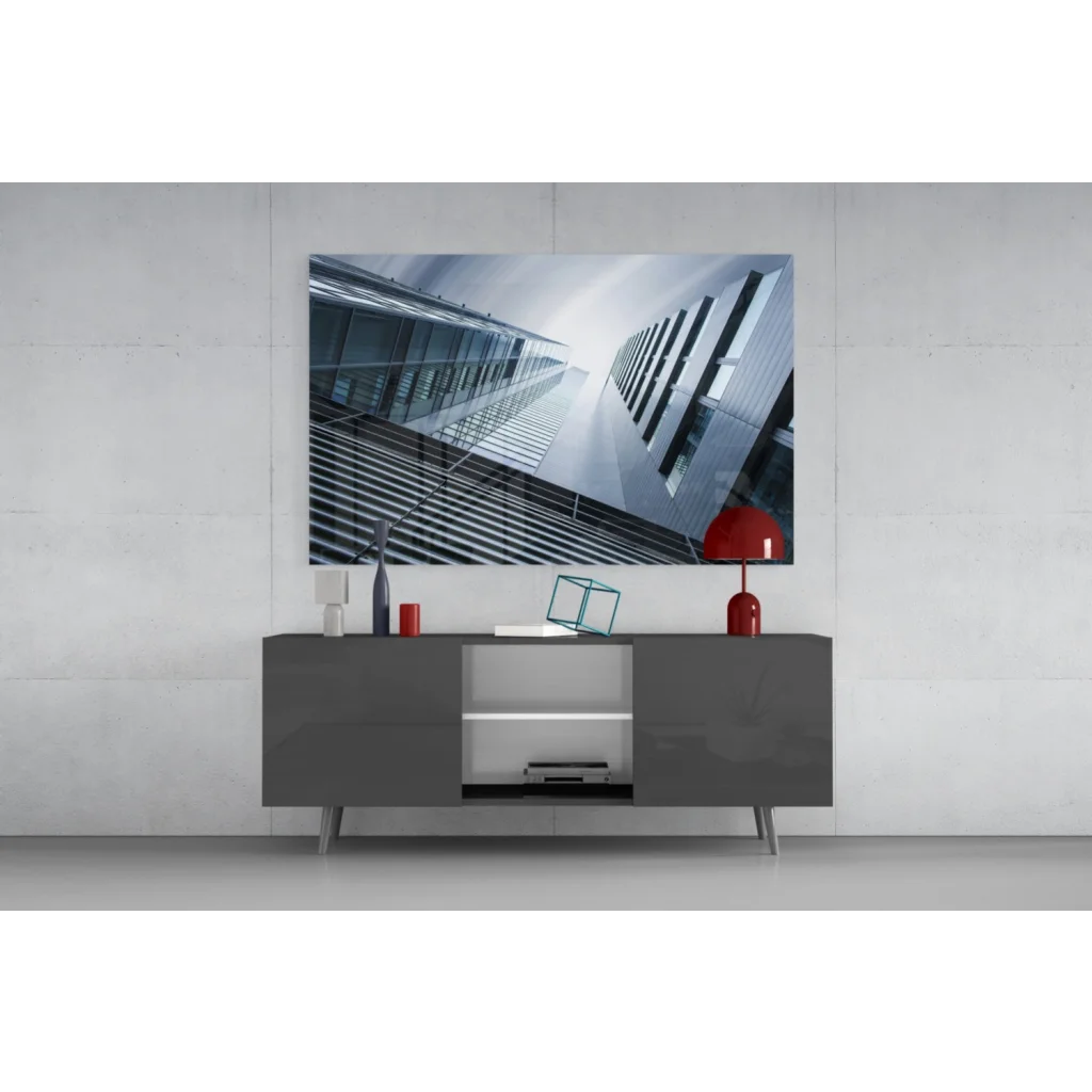 Sleek Samsung QLED TV in black frame on silver legs as glass wall art