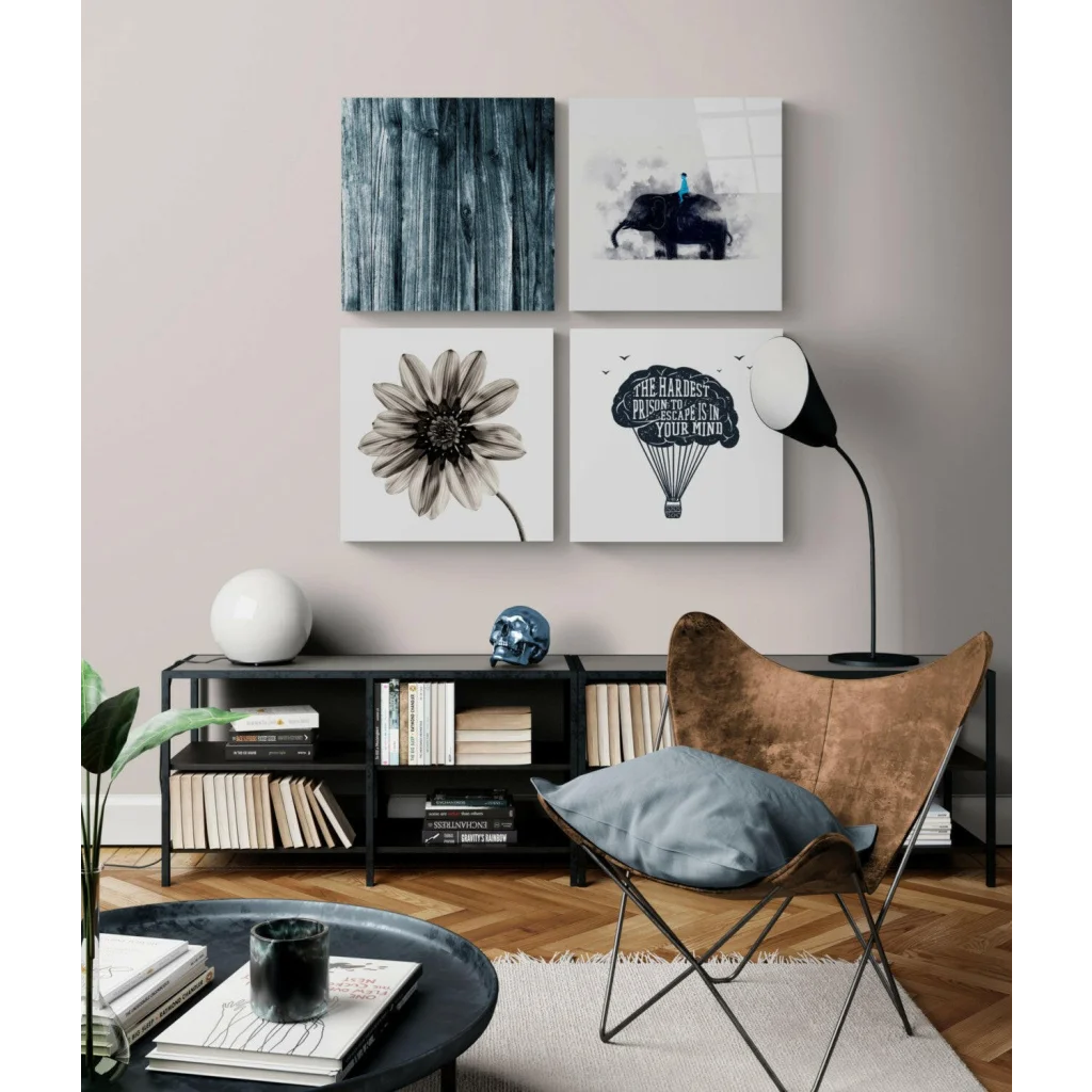 Stunning glass wall art with black butterfly chair, gold cushion, blue pillow