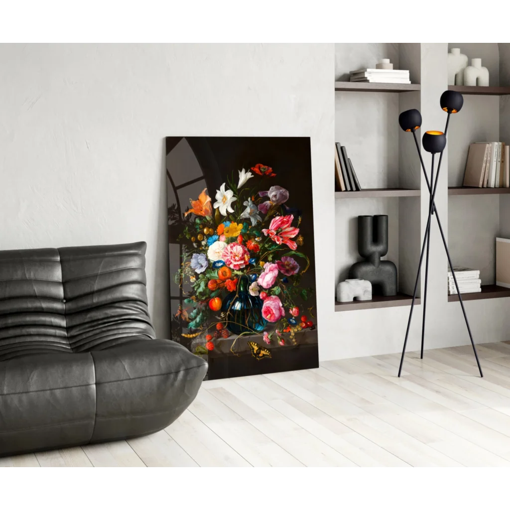 Vibrant floral glass wall art in blue vase on black leather couch