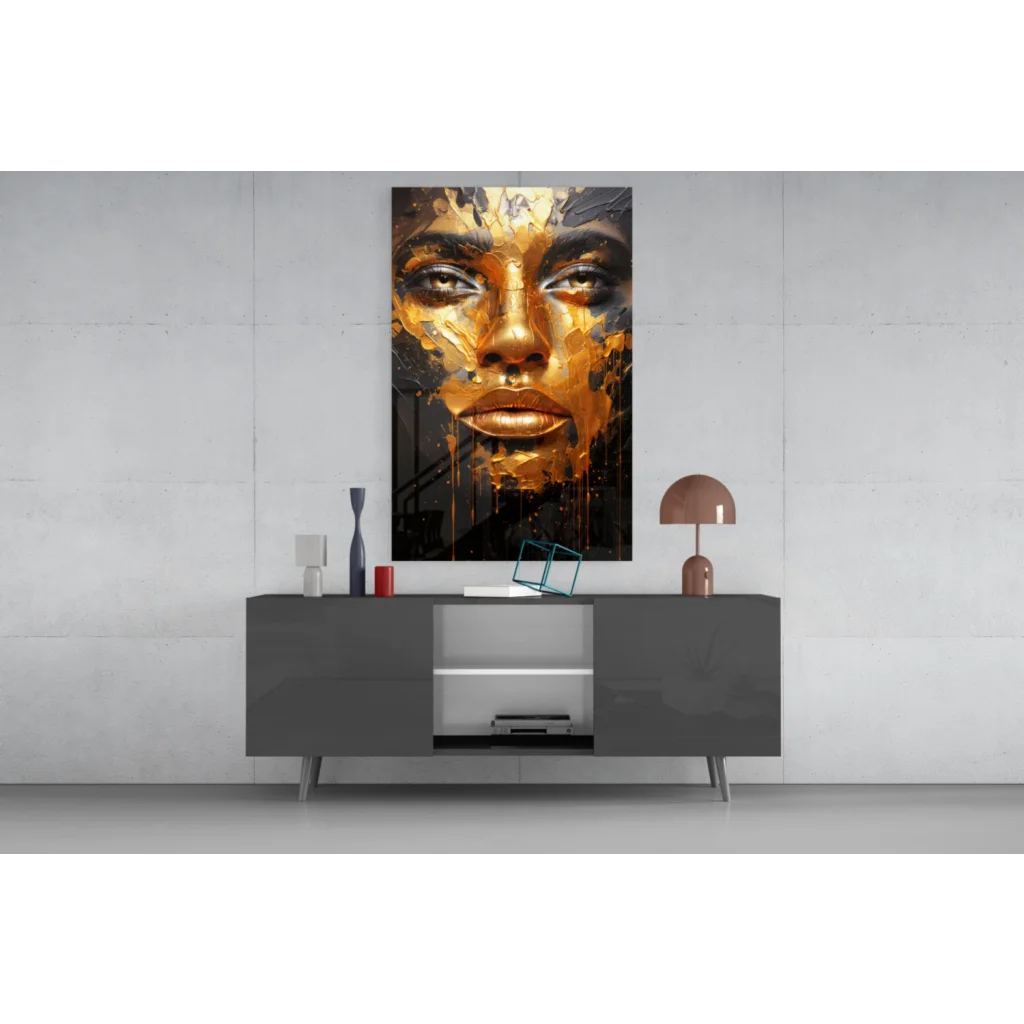 Gold leaf face wall art print on gray sideboard with modern lamp