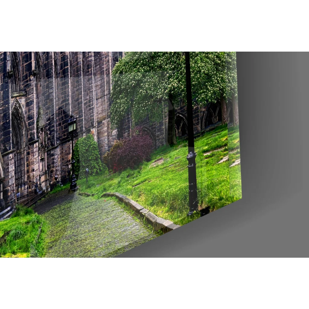 Green grass pathway by stone wall and lamp post in gothic cathedral wall art