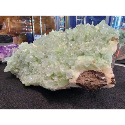 Vibrant green apophyllite crystal cluster from India on brown matrix