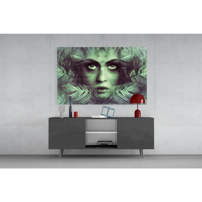 Modern gray sideboard with sleek silver legs under stunning green leafy wall art