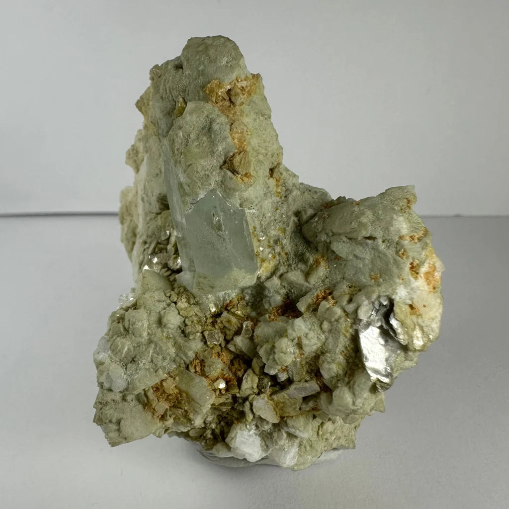 Stunning green quartz crystal in golden flecked rock matrix