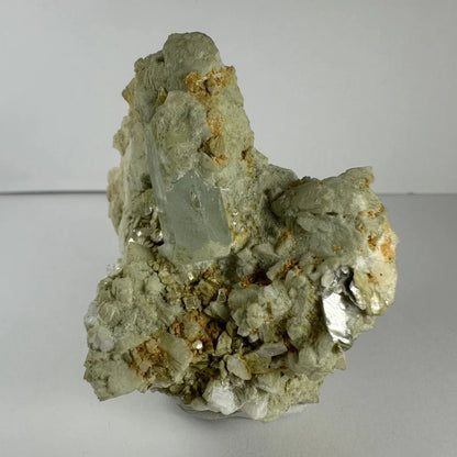 Stunning green quartz crystal in golden flecked rock matrix