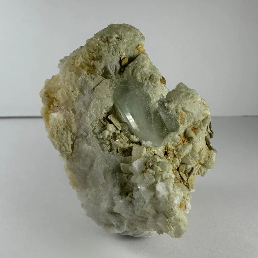 Stunning green quartz crystal in golden flecked rock matrix