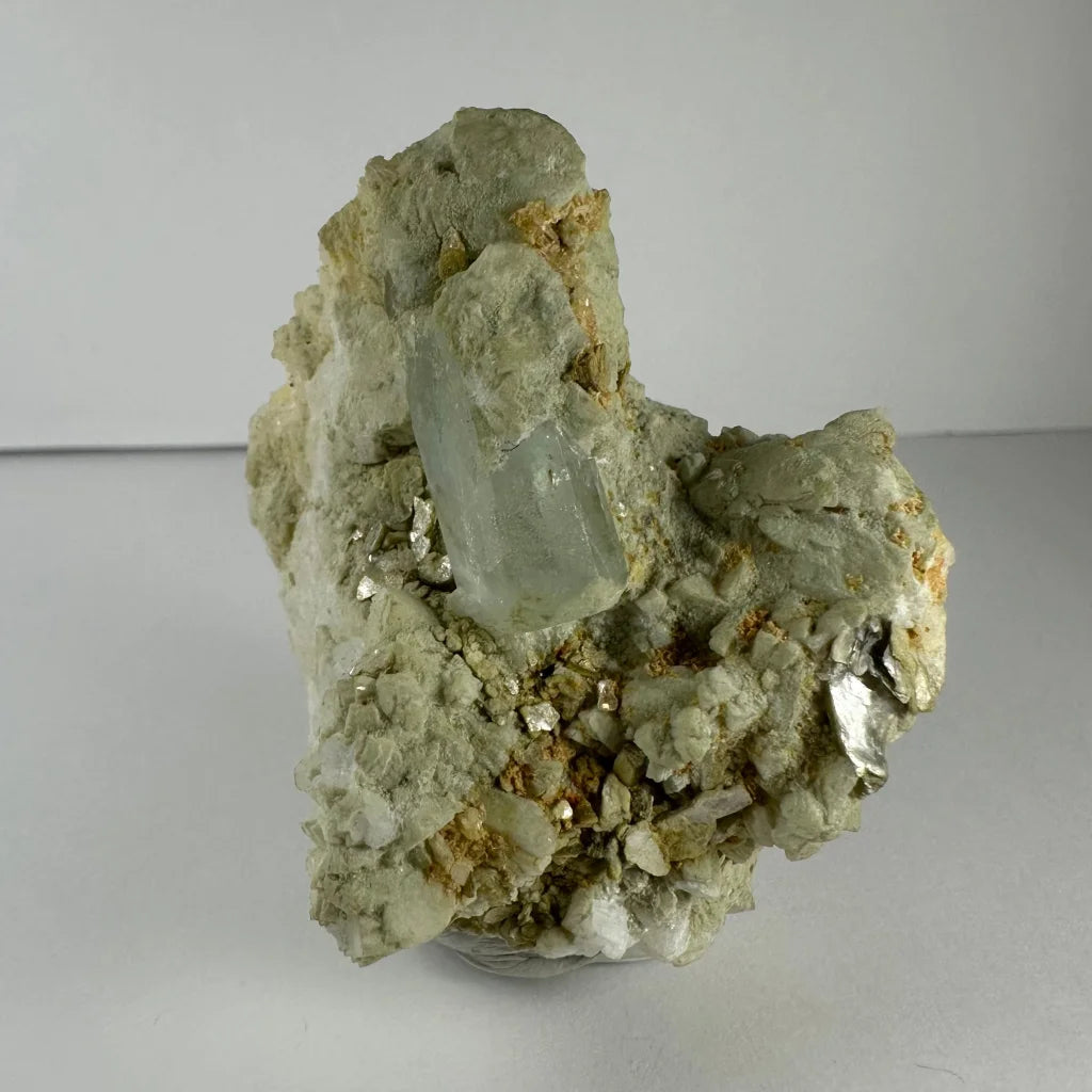 Stunning green quartz crystal in golden flecked rock matrix