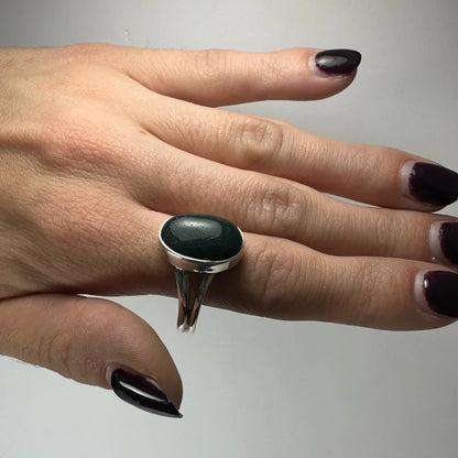 Sleek silver green serpentine ring with oval gem in split band