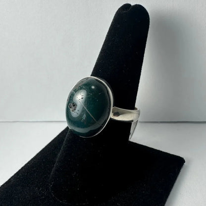 Sleek sterling silver serpentine ring with oval green jasper stone