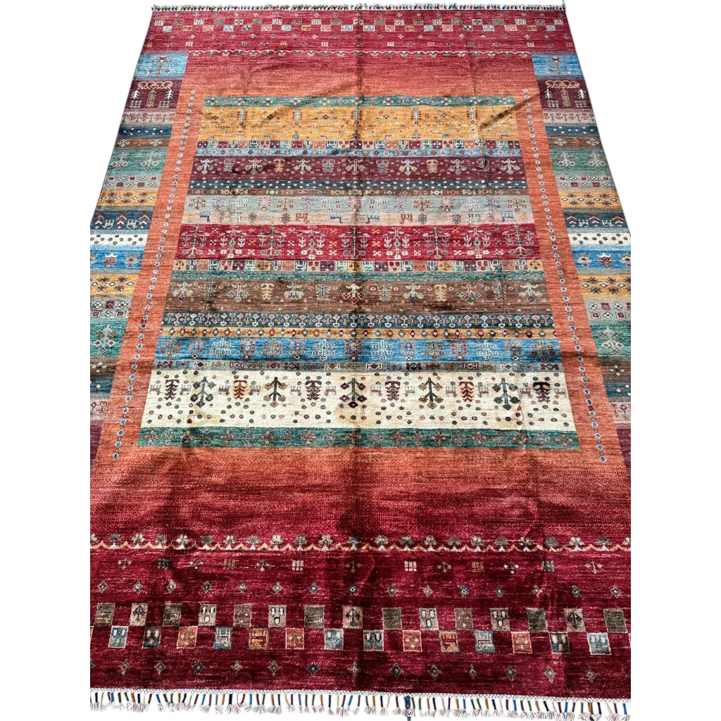 Vibrant hand-knotted Afghan Ghazni wool tribal rug with red base and geometric patterns