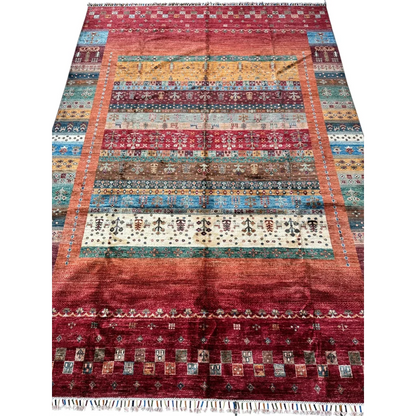 Vibrant hand-knotted Afghan Ghazni wool tribal rug with red base and geometric patterns