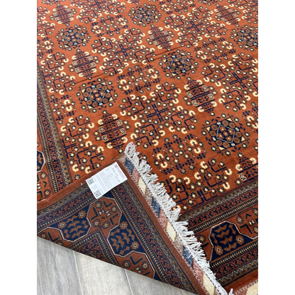 Stunning hand-knotted Afghani Bukharayi rug in orange, navy, and cream patterns