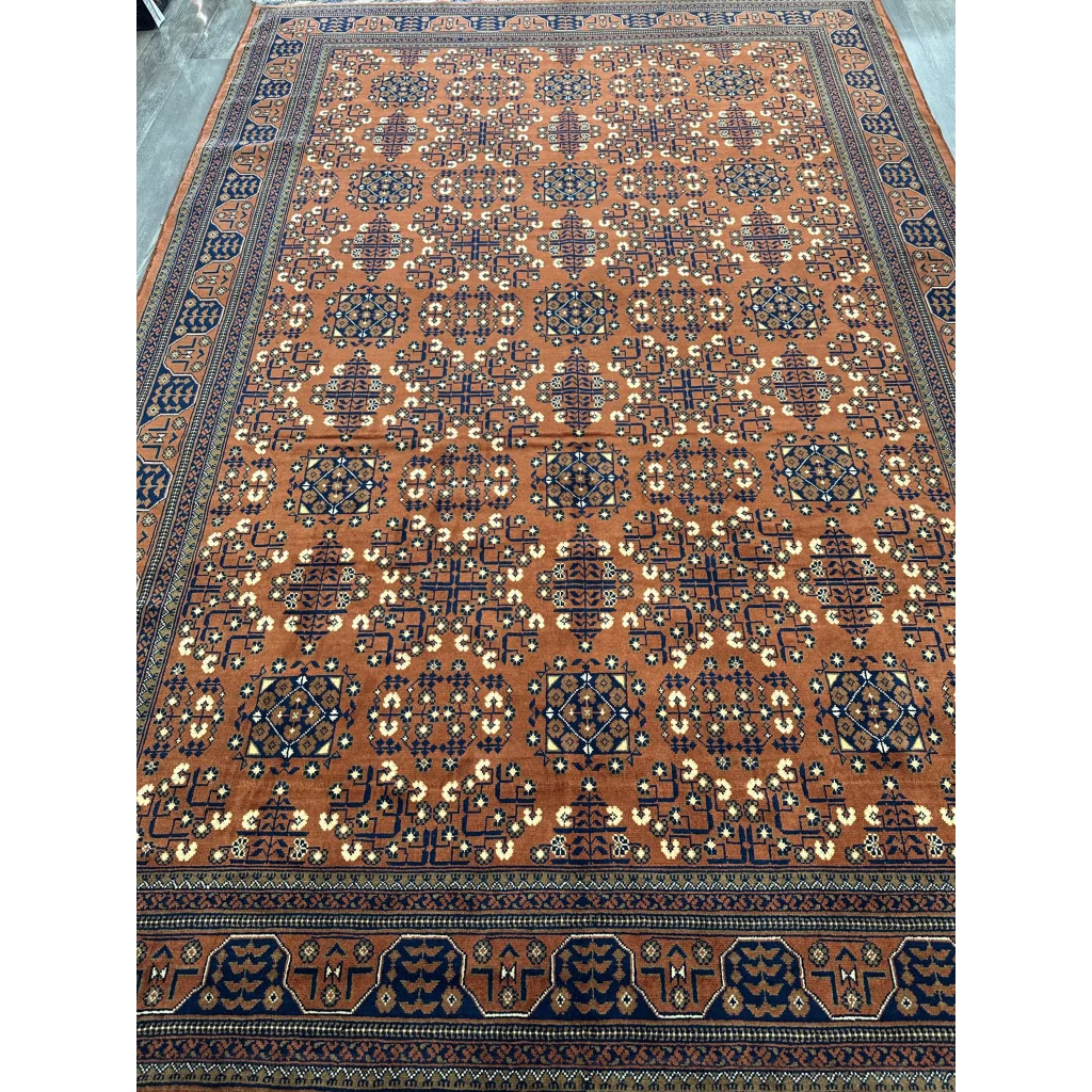 Stunning orange navy Afghani Bukharayi rug with bold geometric patterns