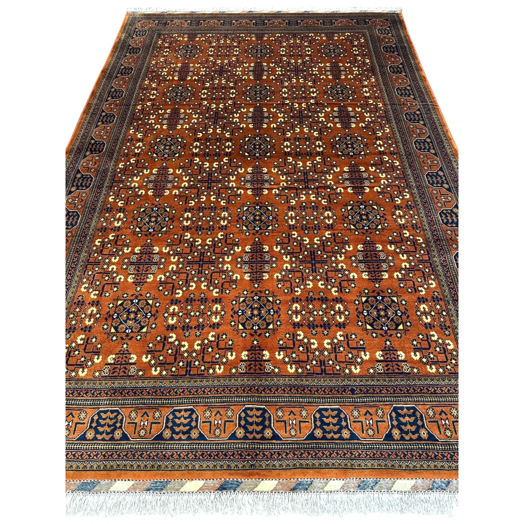Handwoven Afghani Bukharayi rug in orange and navy with bold geometric patterns