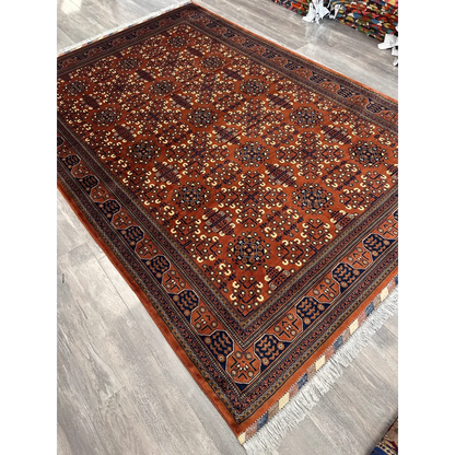 Stunning Afghani Bukharayi rug in rust-orange with bold geometric patterns