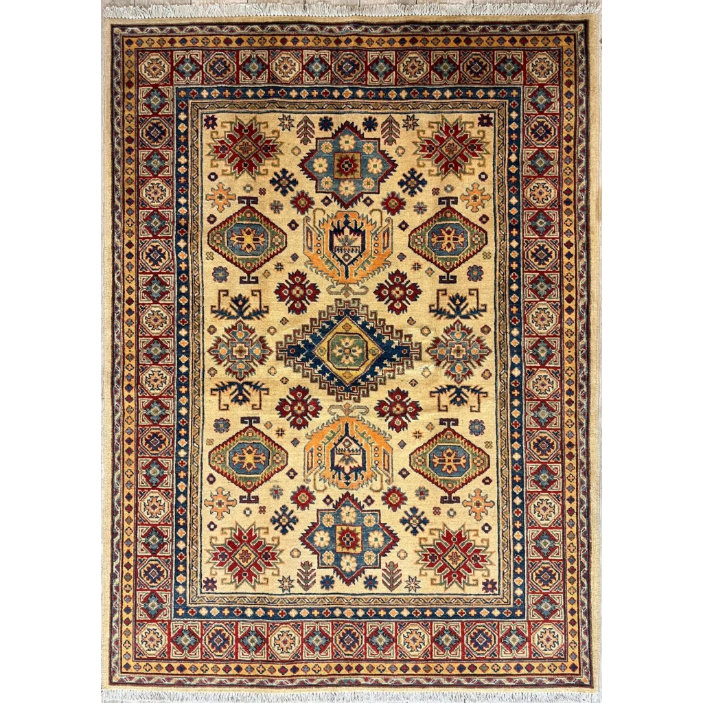 Hand-knotted Afghan Kazak rug in beige with intricate geometric patterns in red, blue, green and orange