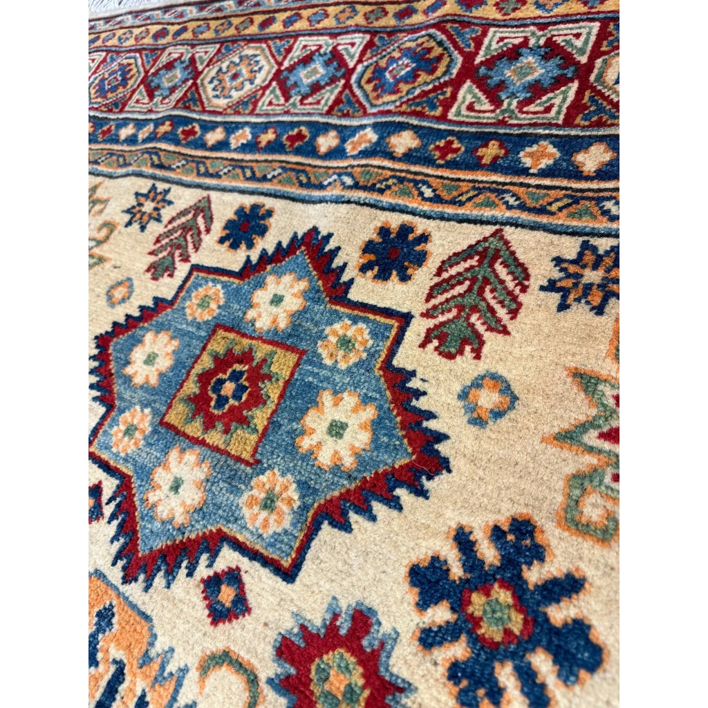 Afghan Kazak hand-knotted rug in beige with blue, red and green geometric patterns