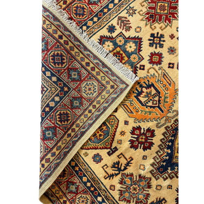 Hand-knotted Afghan Kazak rug in beige with red, blue, orange geometric patterns and fringed edge