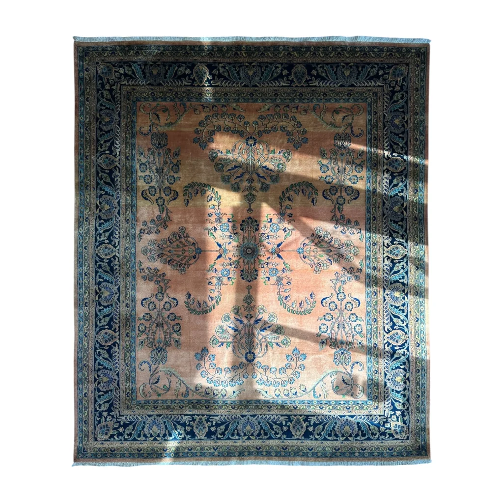 Stunning hand-knotted wool rug with navy border and peach florals